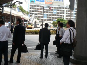 Everywhere...everywhere, men in black suits, a/k/a Salarymen